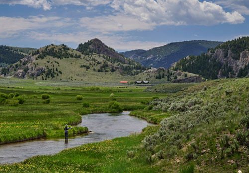 stream, mountains, and man fly fishing
